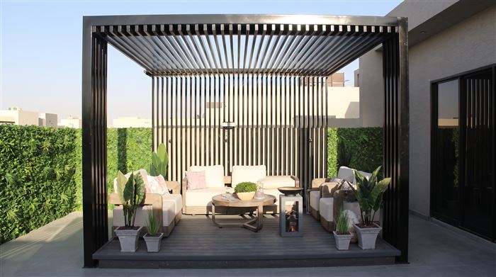 Outdoor pergola majlis with modern lounge furniture